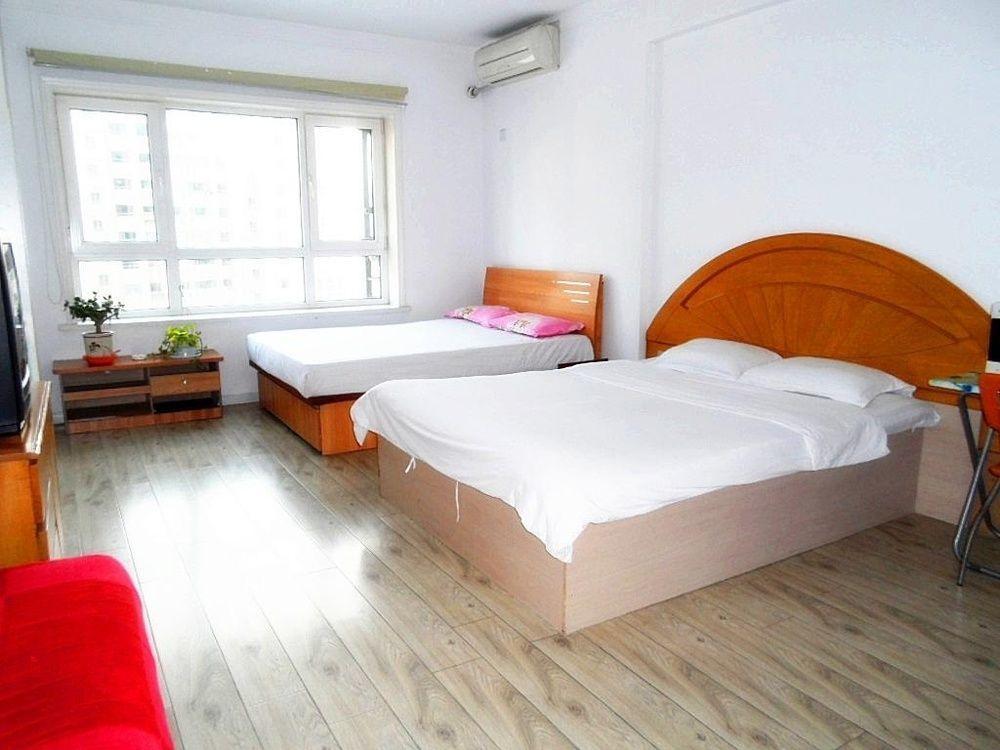 Dalian Jiujiuyuan Apartment Hotel Exteriör bild