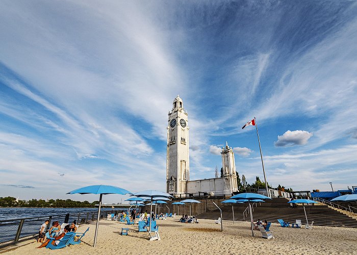 Montreal Clock Tower Sip summer cocktails on this free beach in Montreal's Old Port photo