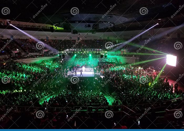 Neal S. Blaisdell Center WWE Wrestler Makes Entrance in Ring with Crowd Watching at WWE ... photo